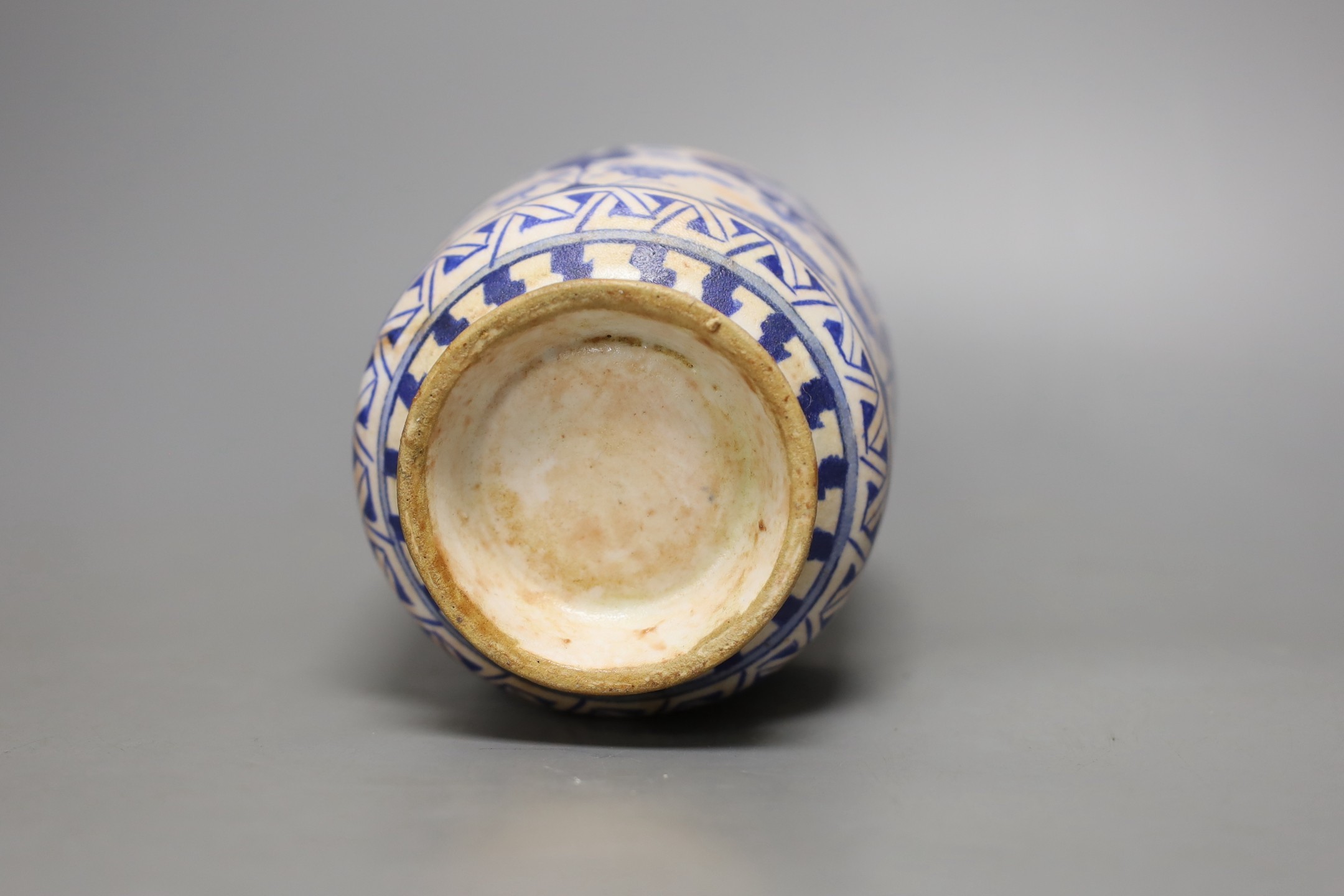 An Iznik fritware vase, 20.5 cms high.